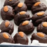 almond joy stuffed dates placed in a white tray.