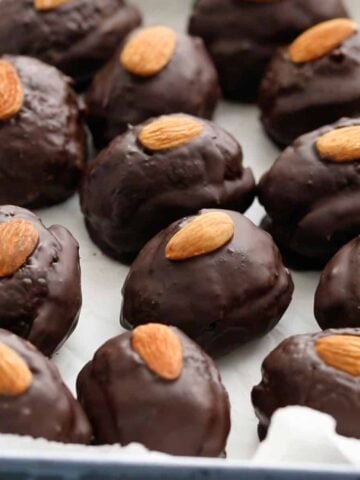 almond joy stuffed dates placed in a white tray.