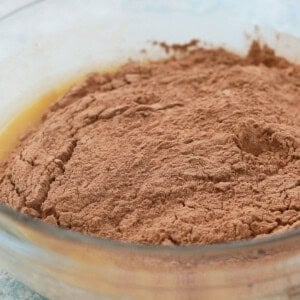 brown flour in a glass bowl.