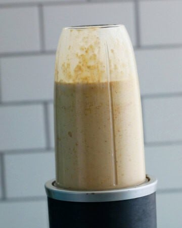 a blender blending cottage cheese waffles batter.