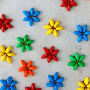 colored candy flowers on a white paper.