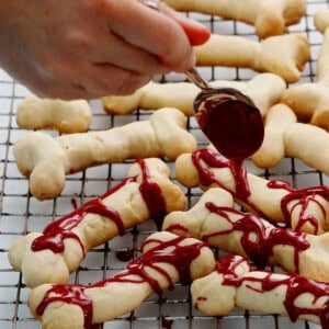 bone shaped cookies on a wire rack.