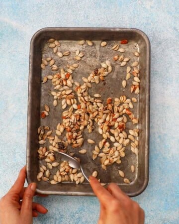 butternut squash seeds in a baking sheet.