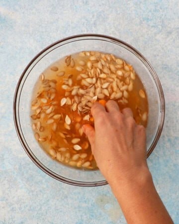 butternut squash seeds in a glass bowl.