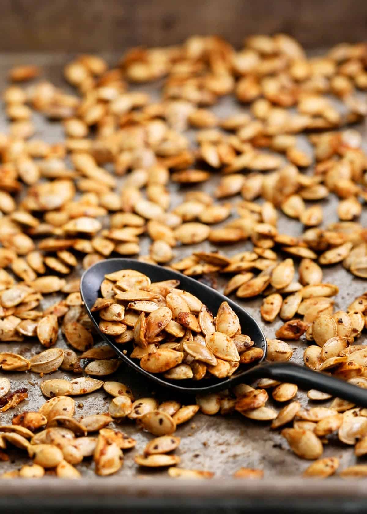butternut squash seeds in a baking sheet.
