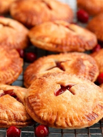 apple cranberry hand pies on a wire rack.