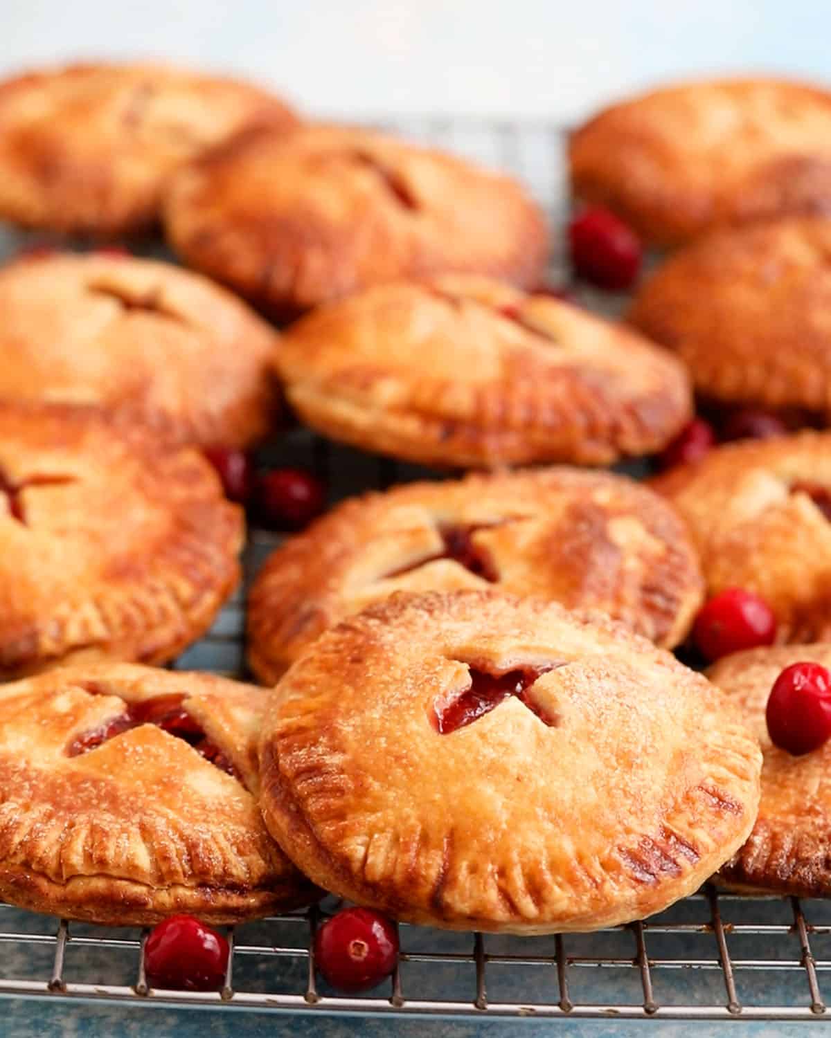 apple cranberry hand pies on a wire rack. 