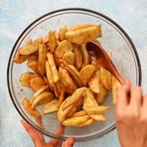 brown apple slices in a glass bowl.