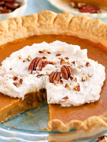 butternut squash pie in a glass pie dish.