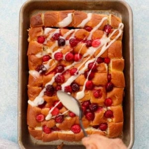 cranberry orange rolls in a metal sheet pan.