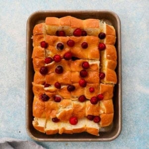 cranberry orange rolls in a metal sheet pan.