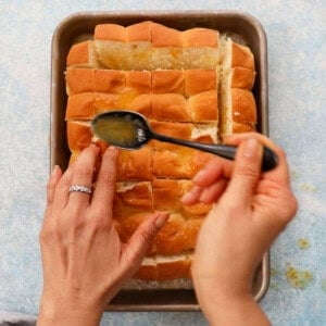 orange rolls in a metal sheet pan.