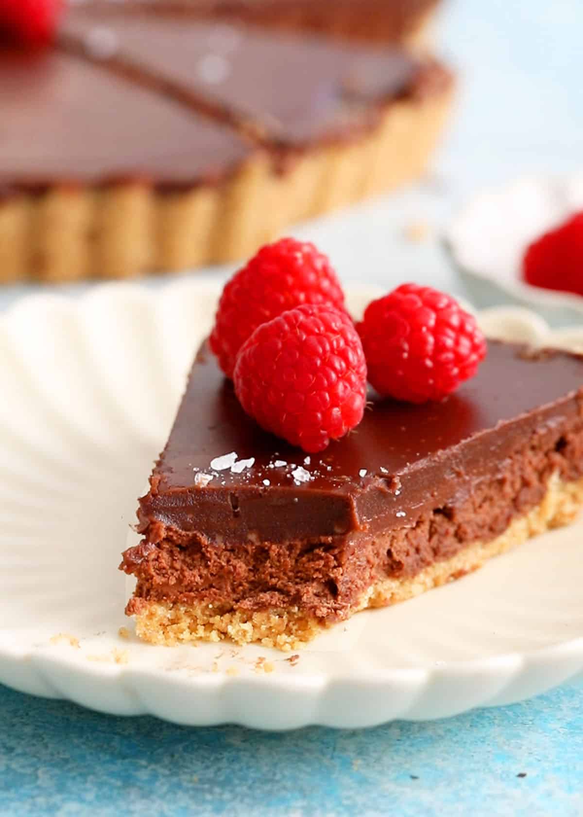 one slice of chocolate tart in a white plate.