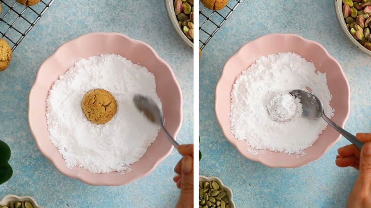 one round pistachio snowball cookie in a pink bowl with white sugar.