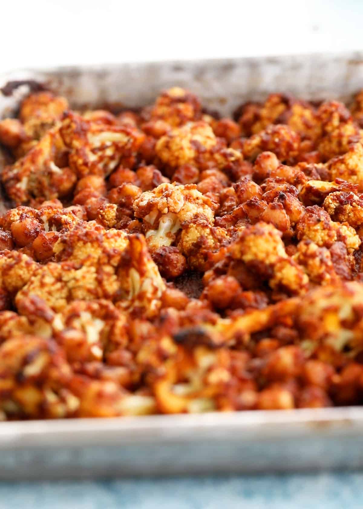 roasted chickpeas and cauliflower in a sheet pan.