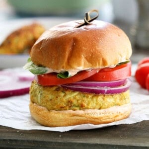 one chicken zucchini burger placed on a white paper.