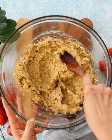 ground chicken zucchini burger mixture in a glass bowl.