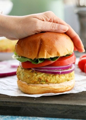 one chicken zucchini burger placed on a white paper.