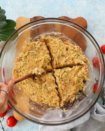ground chicken zucchini burger mixture in a glass bowl.
