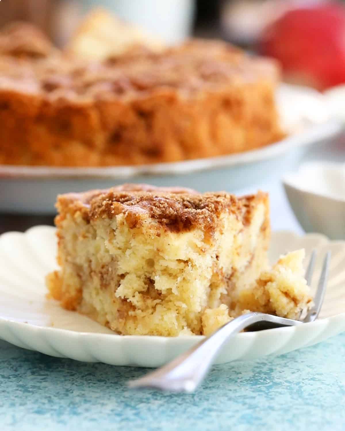 one slice of apple cake in a white plate.