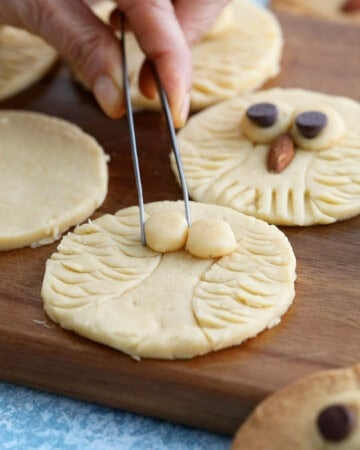 owl cookies on a brown board.
