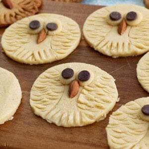 white cookie dough circles on a brown board.