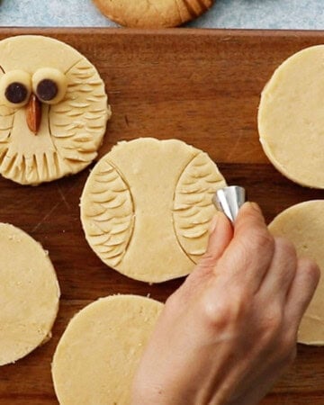 owl cookies on a brown board.