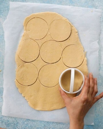 rolled cookie dough on a white paper.